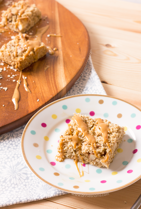 Caramel Apple Oatmeal Bars | Annie's Noms - These Caramel Apple bars are so easy to make, yet beautifully satisfying! A crumble oat mixture is layered with spiced apples before being baked and drizzled with caramel sauce. All of our favourite Fall flavours in one bar.