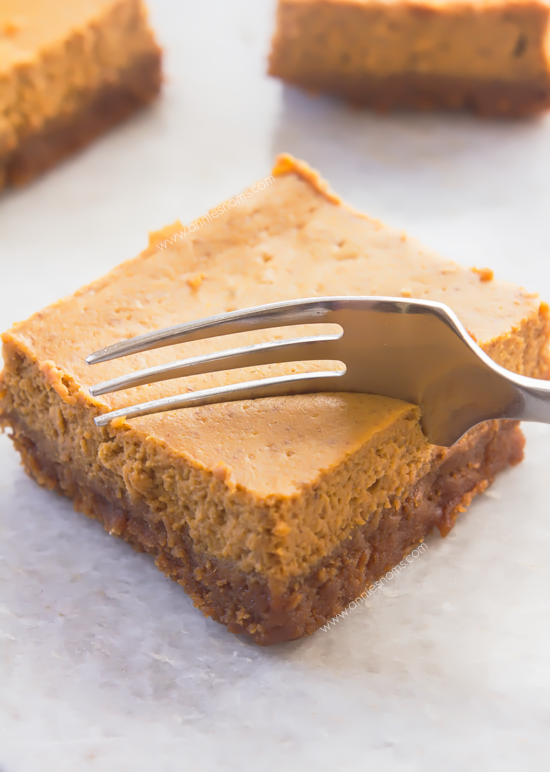 Pumpkin Cheesecake Bars with Biscoff Cookie Crust - These Pumpkin Cheesecake Bars have a sweet, spicy, soft filling and are married with the most amazing Biscoff Cookie Crust! 