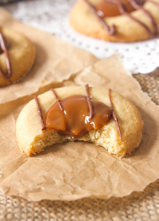 Crisp, buttery cookie dough is topped with sweet, rich dulce de leche and melted chocolate to create tiny little bites of heaven!