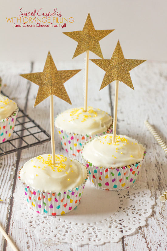 These soft, spiced cupcakes, contrast with their citrusy, sweet orange filling perfectly. And are finished off with cream cheese frosting and sprinkles!