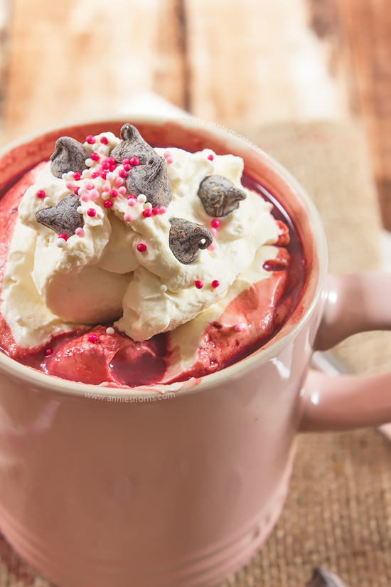 This velvety smooth Red Velvet Hot Chocolate is topped with sweetened whipped cream and chocolate to make a satisfying, rich beverage for this Valentine's Day!