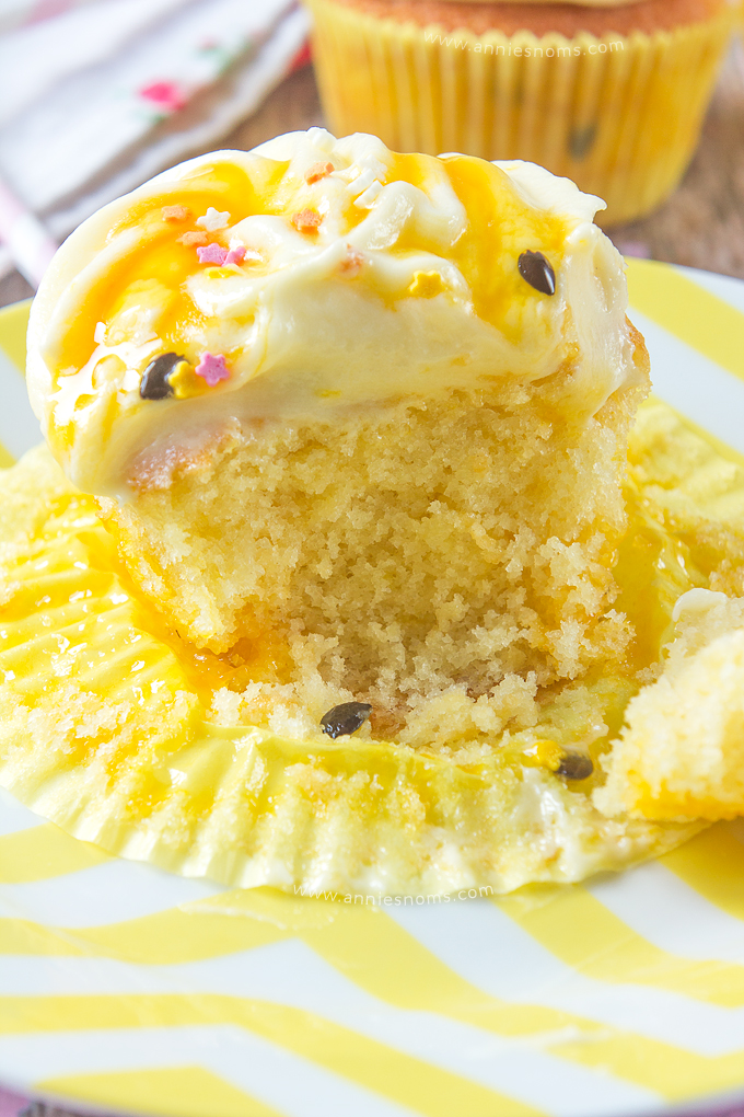 These Lemon and Passion Fruit Cupcakes are light, delicate and pack a real flavour punch. Tender lemon cupcakes, with Passion Fruit Coulis inside the cake and on top of the frosting - these are the perfect cupcakes to welcome Spring!