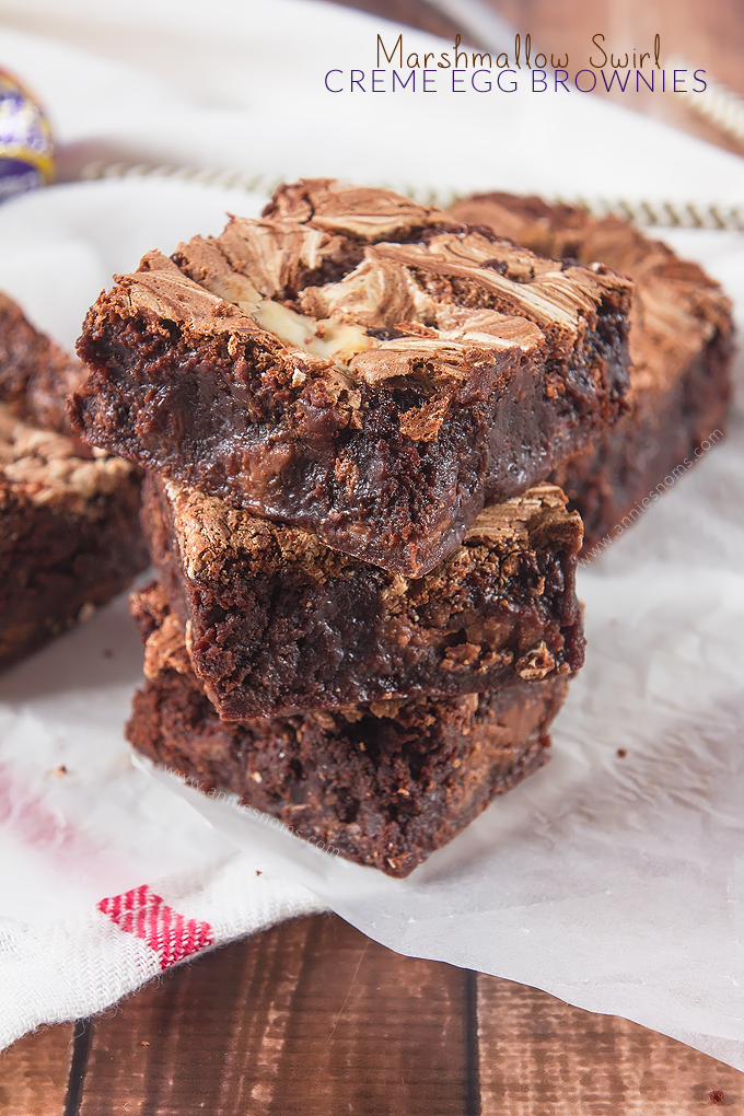 These Marshmallow Swirl Creme Egg Brownies are too decadent for words! Super fudgy brownies, packed with smashed Creme Eggs and swirled with sweet, sticky Marshmallow Fluff - a chocolate filled treat for Easter!