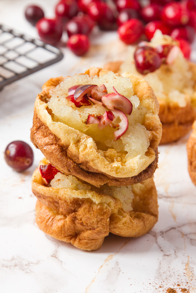 These cute little Apple and Cranberry Puffy Pancakes are the perfect breakfast on the go! Ready in under 30 minutes, you can fill them with whatever fruit you want to make an utterly delicious portable breakfast!