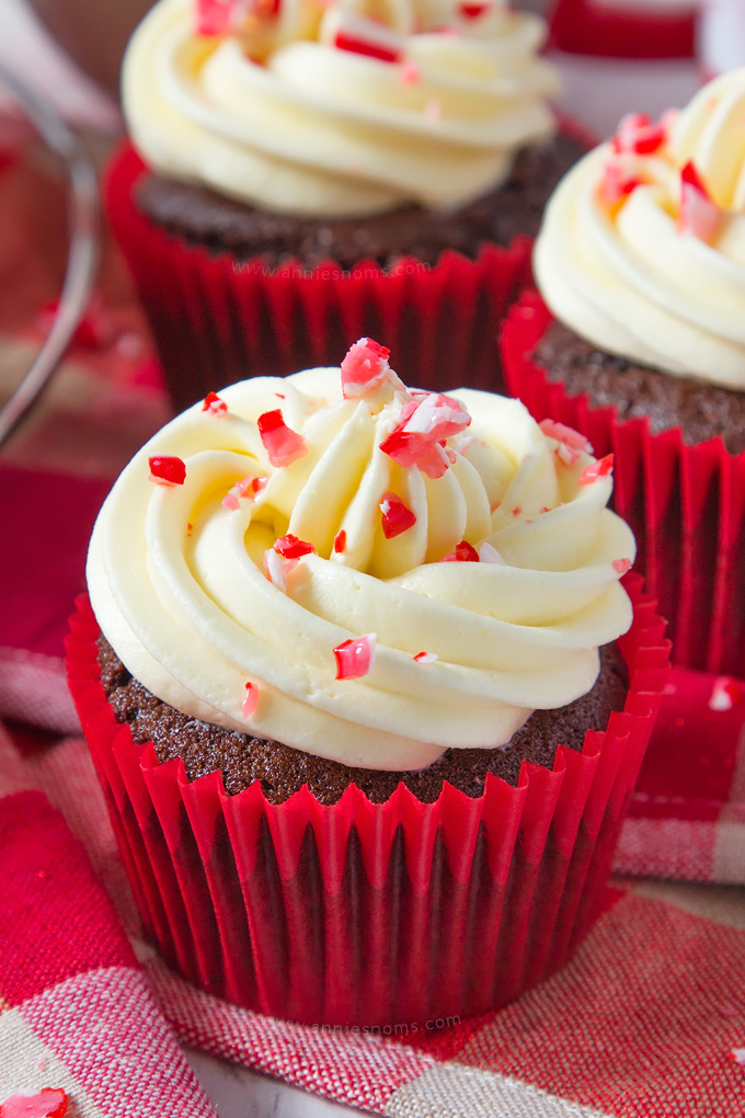 A soft, rich chocolate and peppermint cupcake is topped with smooth, peppermint frosting and finished off with crushed candy canes, creating a fun, festive cupcake!