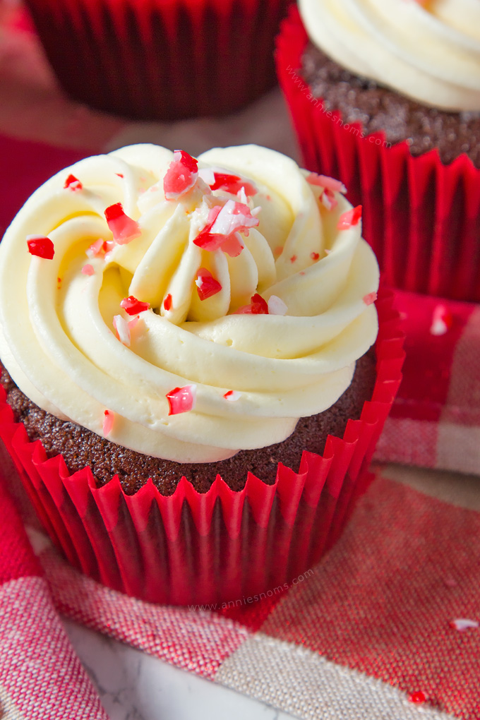 A soft, rich chocolate and peppermint cupcake is topped with smooth, peppermint frosting and finished off with crushed candy canes, creating a fun, festive cupcake!