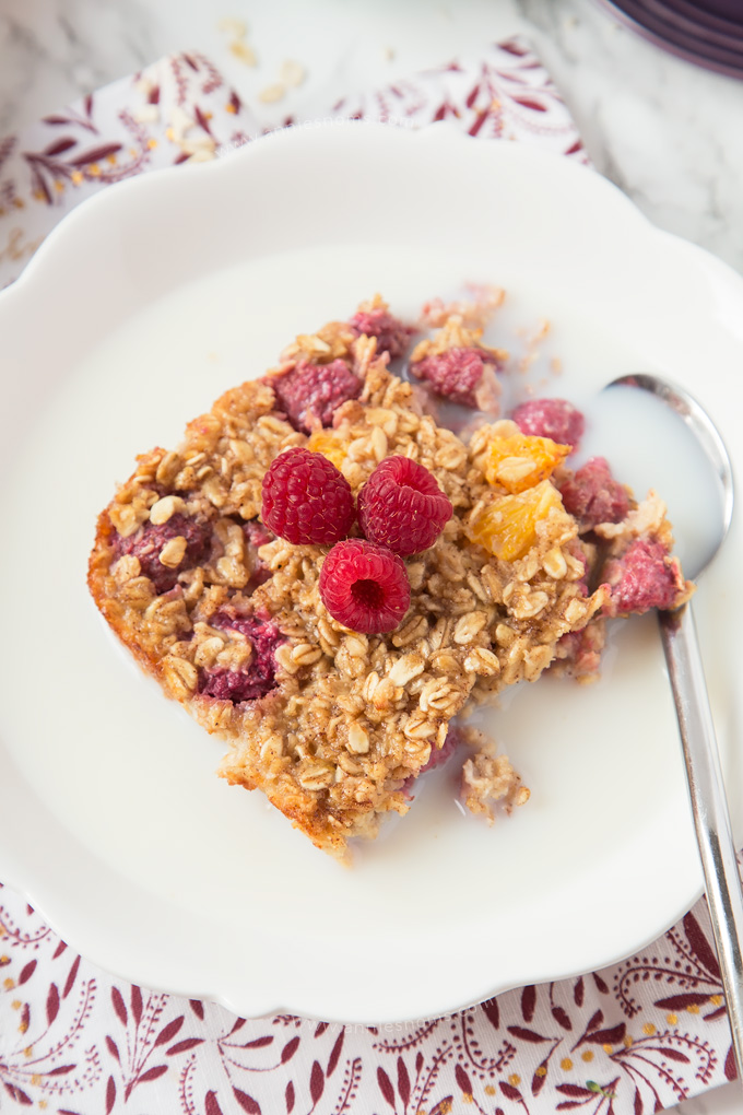 This Orange and Raspberry Baked Oatmeal is the perfect make ahead, healthy breakfast for the whole family! It's delicious and so easy to make!