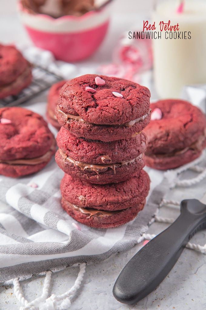 Soft, chewy Chocolate Chip filled Red Velvet Cookies sandwiched together with creamy, smooth chocolate spread to make a cute and delicious Valentine's treat!