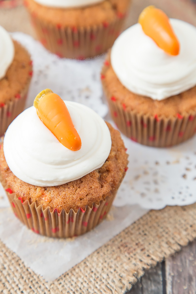 These Carrot Cupcakes are spicy, sweet, jam packed with shredded carrot and topped with a smooth, fluffy Marshmallow Frosting.