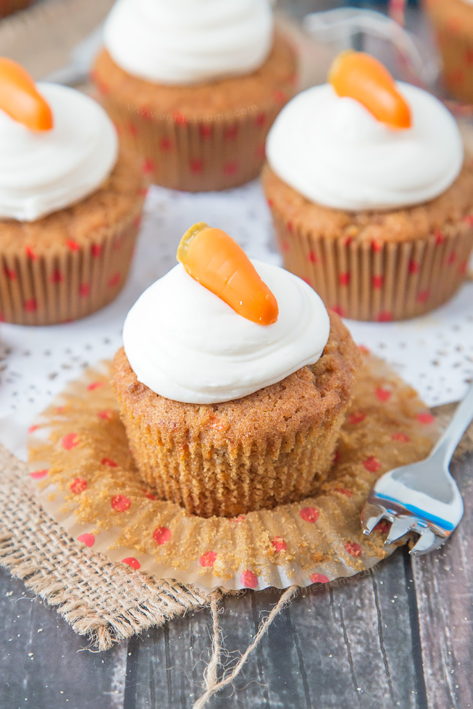 These Carrot Cupcakes are spicy, sweet, jam packed with shredded carrot and topped with a smooth, fluffy Marshmallow Frosting.