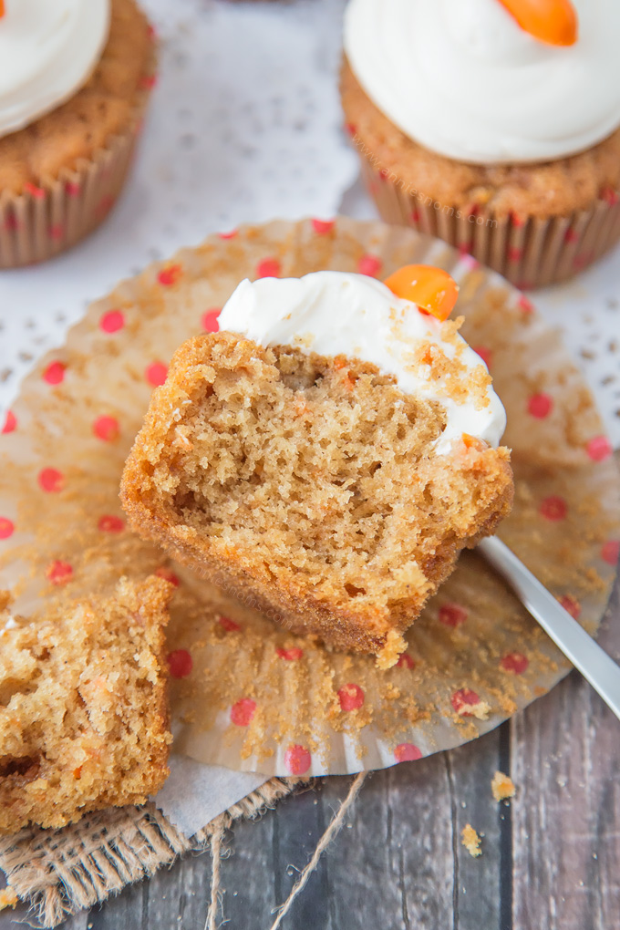 These Carrot Cupcakes are spicy, sweet, jam packed with shredded carrot and topped with a smooth, fluffy Marshmallow Frosting.