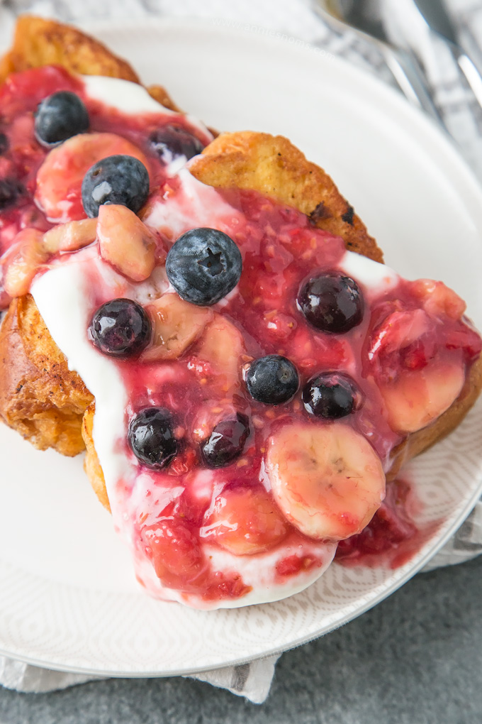 Golden French Toast is topped with a beautiful Banana Berry mixture that takes this breakfast to another level.