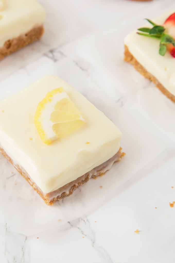 These creamy Lemon and Ginger Cheesecake Bars are easy to make and pack a real flavour punch with their gingersnap crust and zest filled cheesecake top!