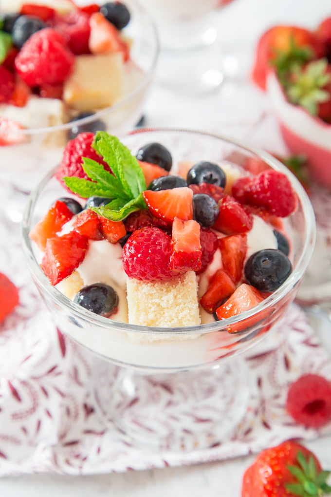 An easy, no bake Summer dessert marrying together yoghurt, cream, berries and cake! Easy to prep and perfect for a crowd!