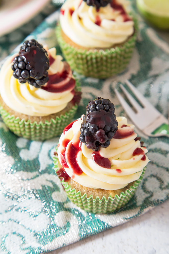 Soft, blackberry filled cupcakes with lime butter cream frosting and blackberry coulis. An explosion of flavour in every bite!