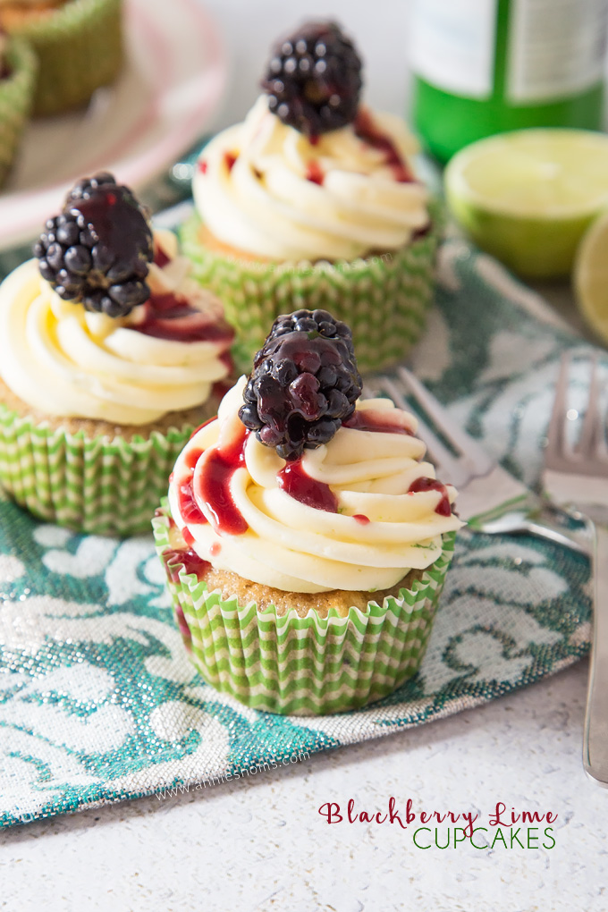 Soft, blackberry filled cupcakes with lime butter cream frosting and blackberry coulis. An explosion of flavour in every bite!