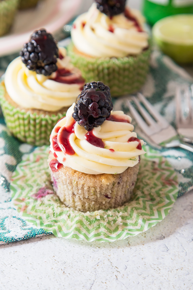 Soft, blackberry filled cupcakes with lime butter cream frosting and blackberry coulis. An explosion of flavour in every bite!