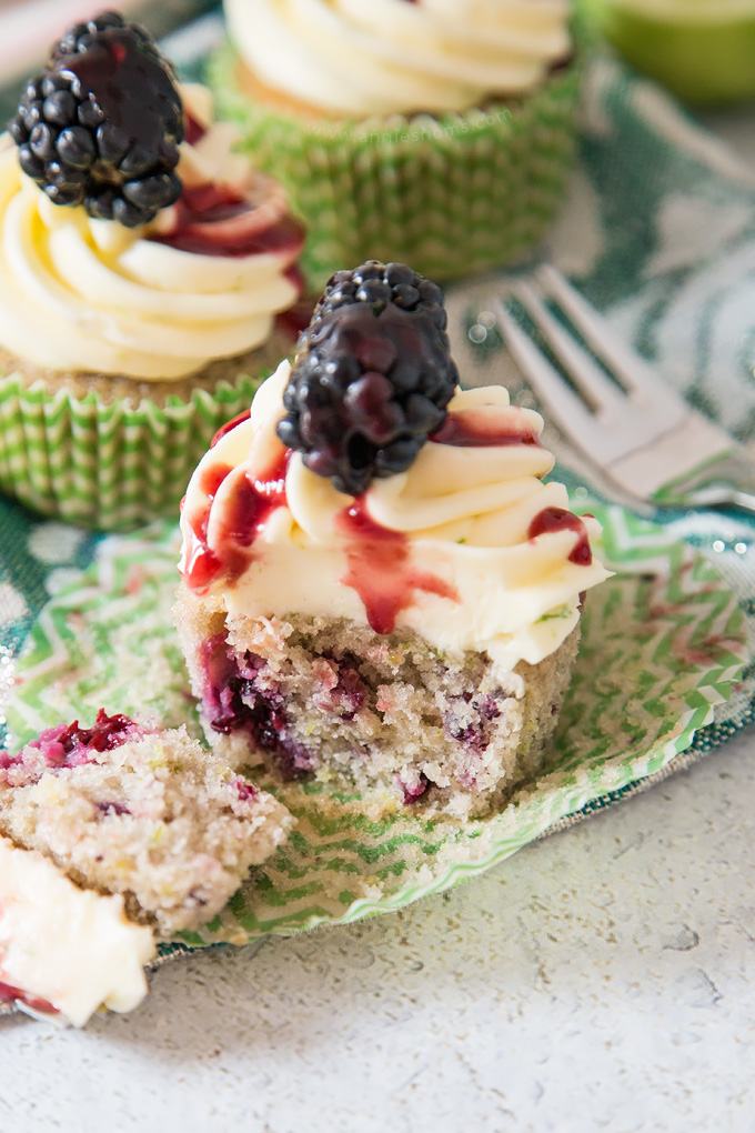 Soft, blackberry filled cupcakes with lime butter cream frosting and blackberry coulis. An explosion of flavour in every bite!