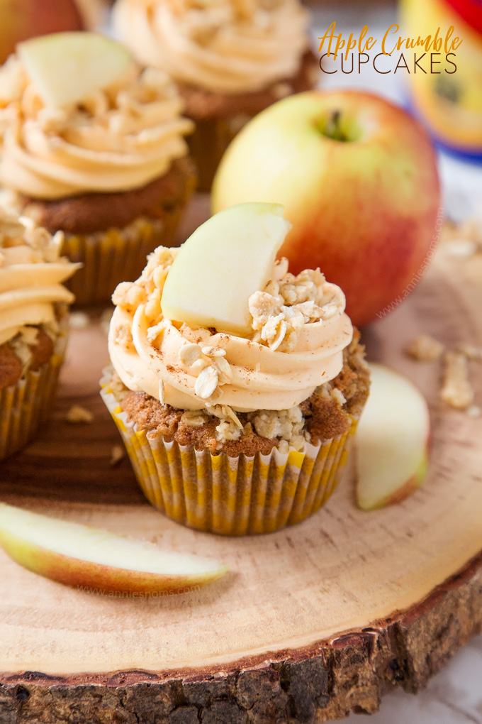 My Apple Crumble Cupcakes are soft, apple filled and topped with deliciously smooth custard frosting and crunchy crumbles. The perfect way to enjoy a classic British dessert!