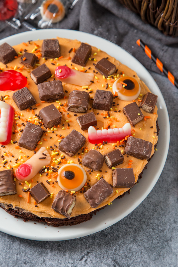 A thick and chewy brownie topped with creamy buttercream and leftover Halloween sweets. Fun to make and super delicious!