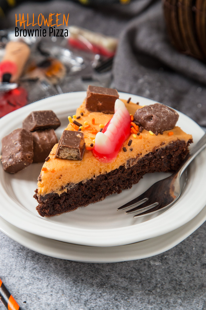 A thick and chewy brownie topped with creamy buttercream and leftover Halloween sweets. Fun to make and super delicious!