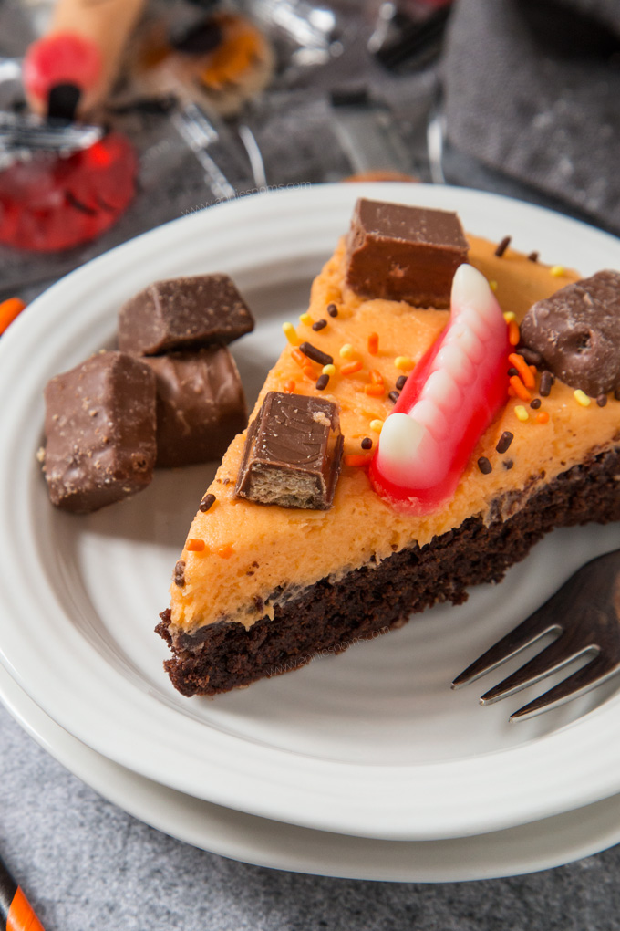 A thick and chewy brownie topped with creamy buttercream and leftover Halloween sweets. Fun to make and super delicious!