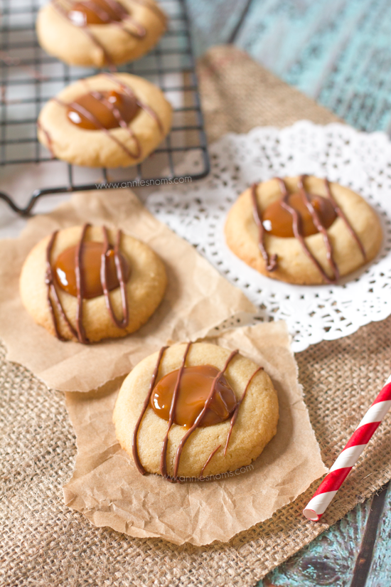 Crisp, buttery cookie dough is topped with sweet, rich dulce de leche and melted chocolate to create tiny little bites of heaven!