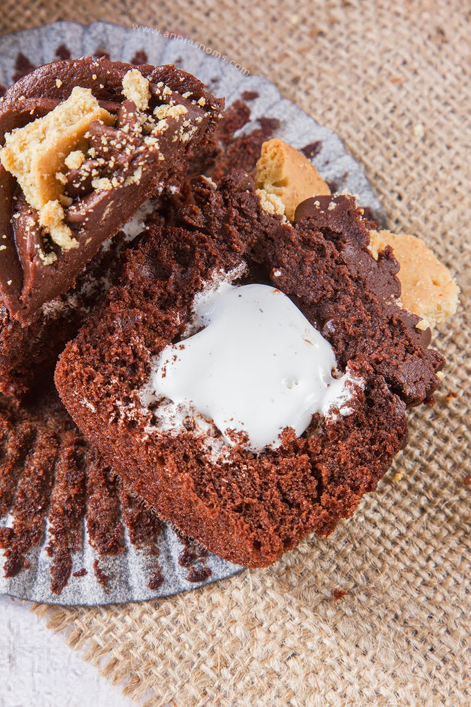 My S'mores Cupcakes are the perfect Summer treat in cupcake form! Rich chocolate cake, filled with marshmallow fluff and topped with velvety smooth chocolate frosting and crushed digestives.