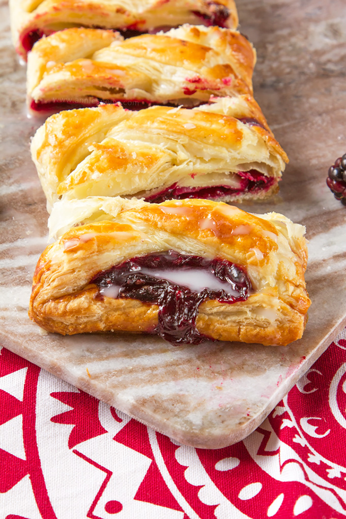 All the flavours of a Blackberry Pie, sandwiched between flaky, golden puff pastry. This easy braid comes together in next to no time and is ready to eat in under 45 minutes. Fruity, crunchy and simple, this braid is pure fruit filled, pastry perfection!