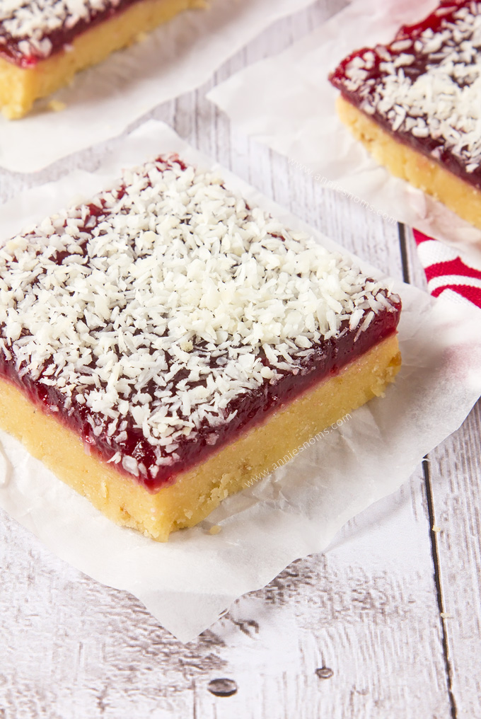 These Raspberry Coconut Bars are super simple to make and with their shortbread base, raspberry jam middle and desiccated coconut topping, they are a combination of sweet, crunchy and tart in one portable dessert!