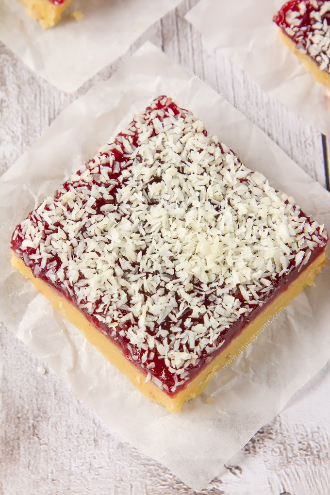 These Raspberry Coconut Bars are super simple to make and with their shortbread base, raspberry jam middle and desiccated coconut topping, they are a combination of sweet, crunchy and tart in one portable dessert!