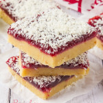 These Raspberry Coconut Bars are super simple to make and with their shortbread base, raspberry jam middle and dessicated coconut topping, they are a combination of sweet, crunchy and tart in one portable dessert!