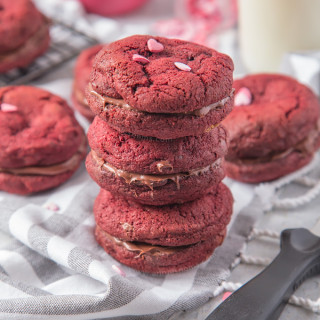 Soft, chewy Chocolate Chip filled Red Velvet Cookies sandwiched together with creamy, smooth chocolate spread to make a cute and delicious Valentine's treat!