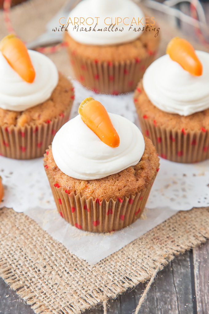 These Carrot Cupcakes are spicy, sweet, jam packed with shredded carrot and topped with a smooth, fluffy Marshmallow Frosting.