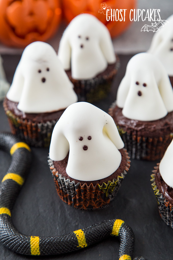 A chocolate frosted cupcake with a fondant ghost atop it; these Ghost Cupcakes are treats that adults and kids alike will love!