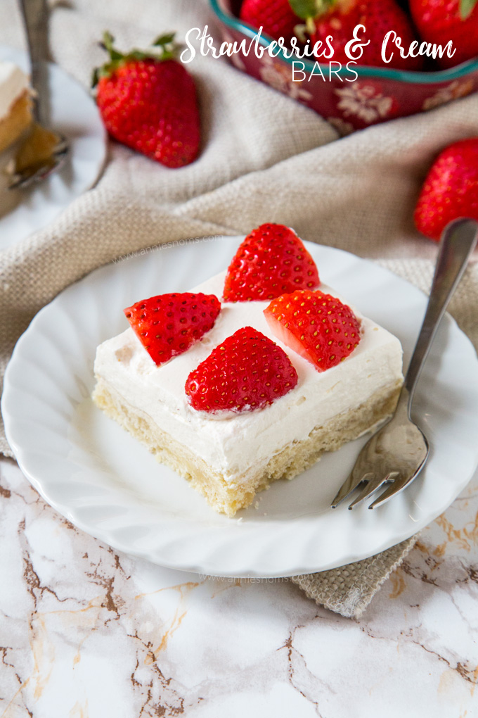 Buttery shortbread is layered with sweetened cream and fresh strawberries to create a flavour explosion in every bite of these Strawberries and Cream Bars!