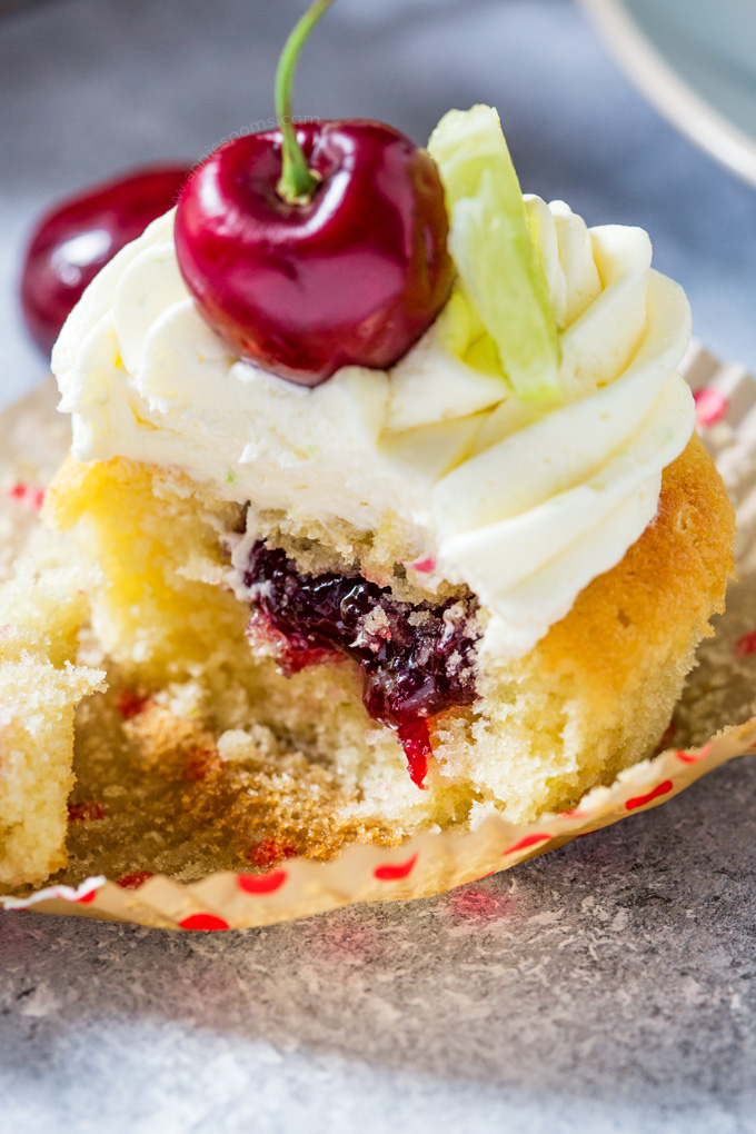 These Cherry and Lime Cupcakes are filled with homemade jam and lime zest. Topped with light, fluffy frosting, they are the perfect balance of tart and sweet.