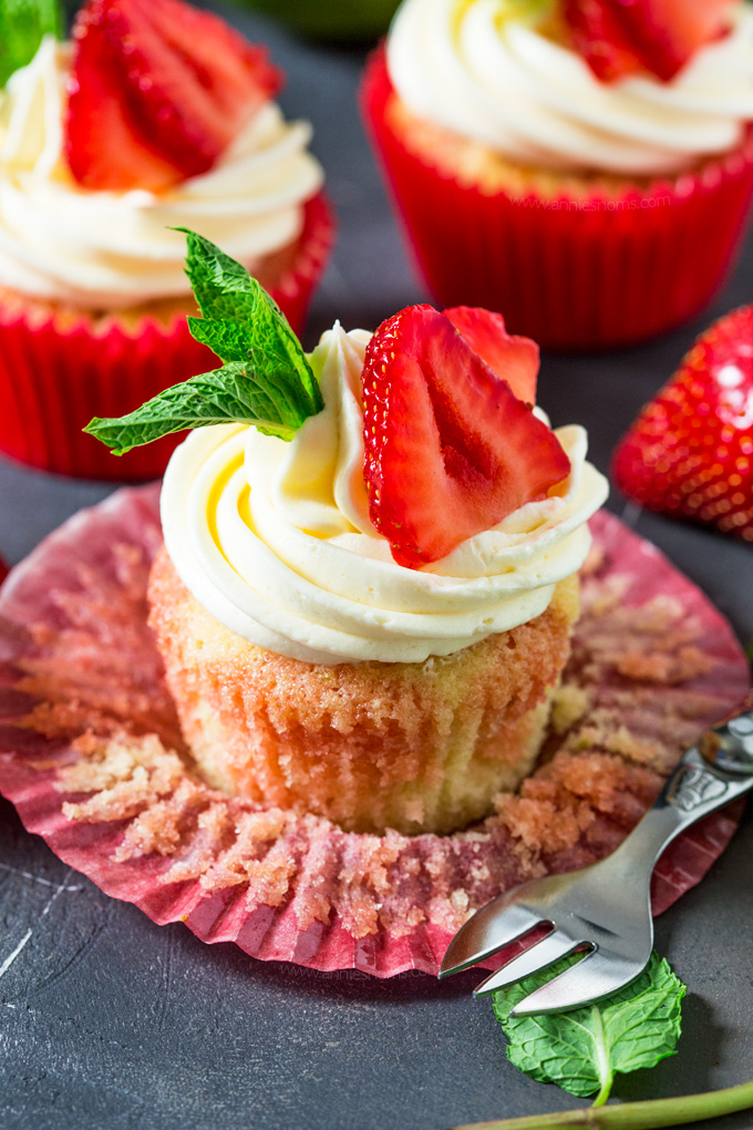These Strawberry Pimms cupcakes are Wimbledon in cupcake form! Lemon and lime cupcakes with a pimms syrup and frosting. Sweet, light and so refreshing! #ad #wimbledon2017
