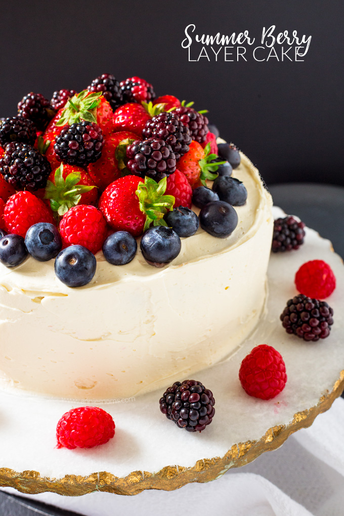 This Summer Berry Layer Cake is the ultimate cake for the berry lovers in your life with layers of vanilla cake, homemade berry jam and a myriad of fresh berries on top.