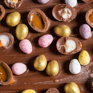 This easy, Easter Chocolate Bark is covered in Creme eggs, caramel eggs, mini eggs and golden eggs. A total egg overload, this recipe is fun to make and perfect for adults and kids alike!