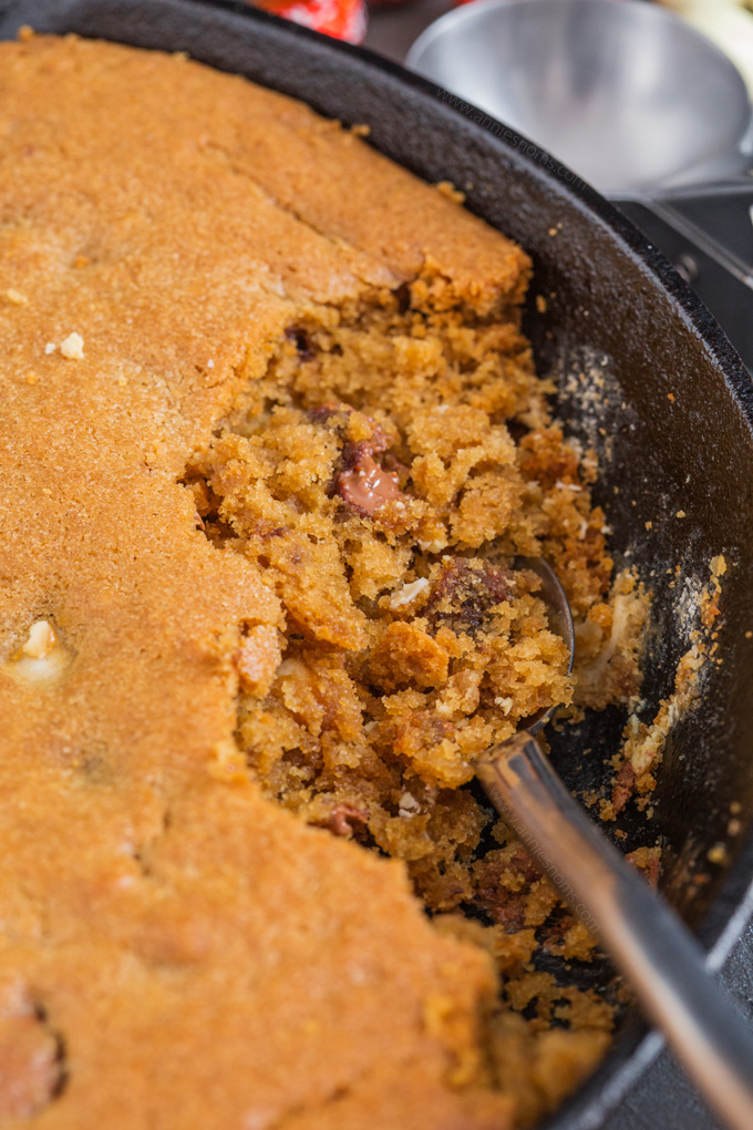 This Easter Skillet Cookie is soft, chewy and perfect for sharing! It's filled with Milkybar mini eggs, Cadbury mini eggs and Lindor Mini eggs and is a melty, chocolatey sensation! Grab your spoons and dig in!