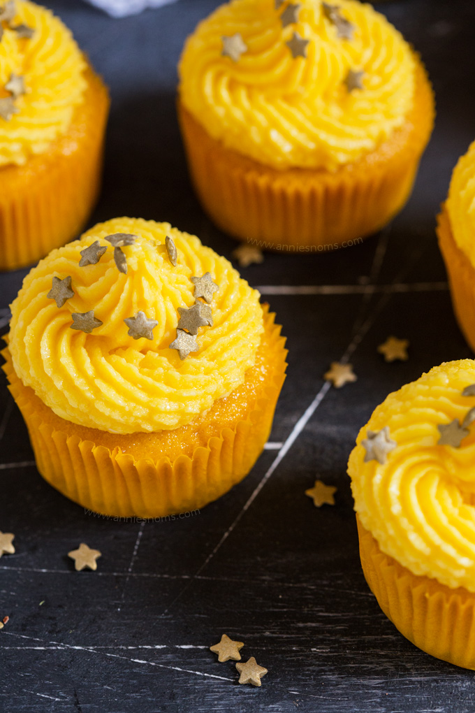 These soft Mango Cupcakes are filled with crushed pineapple and topped with a light and fluffy mango frosting. A delicious tropical cupcake perfect for the warmer weather!