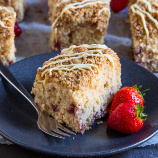 This Strawberry and Lemon Coffee Cake is soft, zingy and filled with juicy strawberries. With its crunchy crumb topping, this is one seriously delicious accompaniment to your coffee!