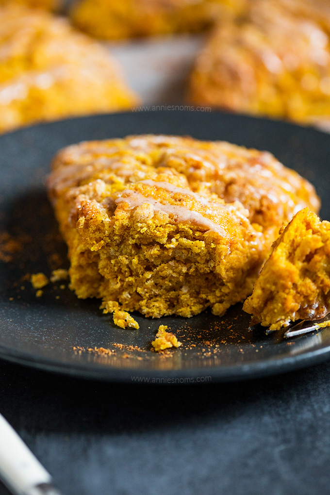These flaky and buttery Pumpkin Scones are drizzled with a spiced glaze to make one seriously awesome breakfast that will start your day on the right foot!