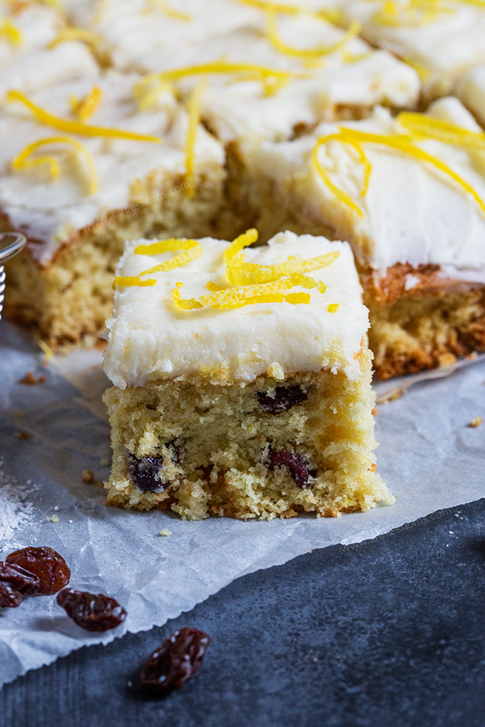 These light and soft Lemon and Cranberry Cake Bars are filled with lemon zest and juicy cranberries. They are simple to make and feed a crowd! ﻿