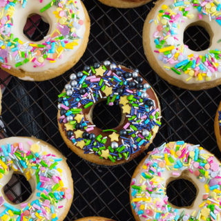 These baked doughnuts require only cake mix and three other ingredients to make! They're light and fluffy and you can dip in any flavour glaze you like!
