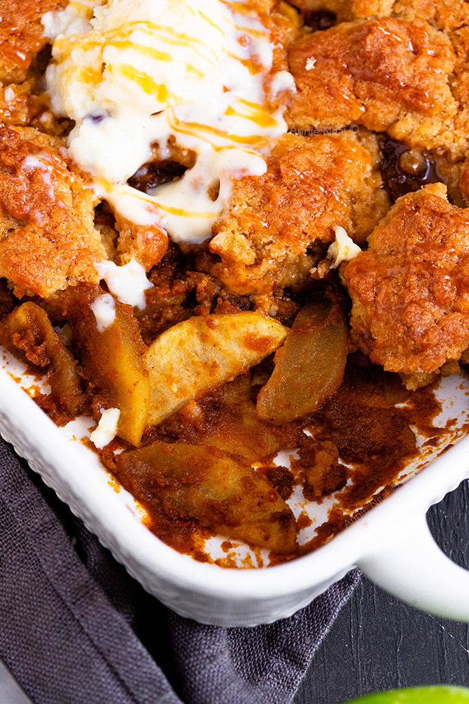 This Pumpkin Apple Cobbler is the epitome of Autumn! Pumpkin, spices, slices of apple and a crunchy, buttery topping make this one delectable dessert you won't be able to resist!