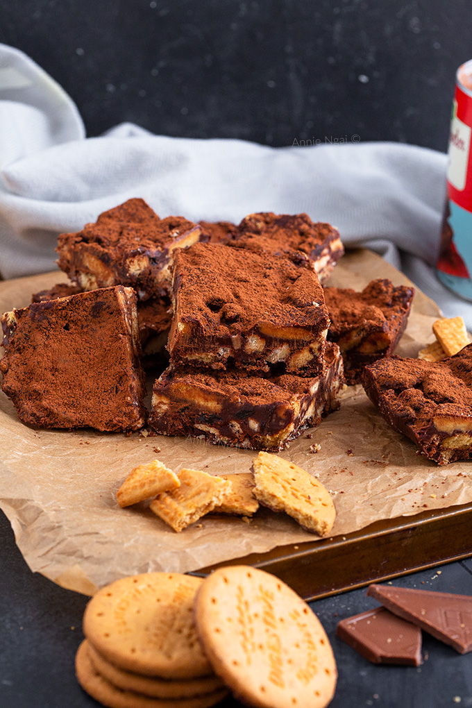 This Chocolate Fridge Cake is kid friendly and so delicious. It uses up biscuits, dried fruit, milk and dark chocolate and can be thrown together in minutes!