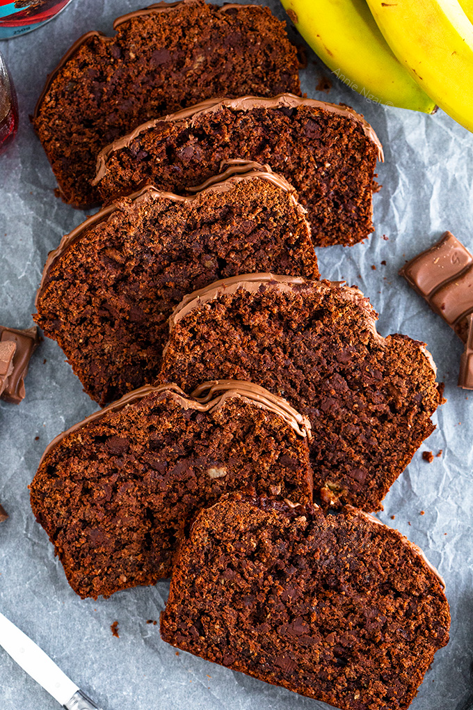 This Healthier Chocolate Banana Bread is made with whole wheat flour, agave, coconut oil and plenty of bananas. It's peppered with dark chocolate chips to create a healthier, but still delicious bread!