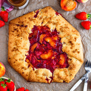 This Strawberry Peach Galette is super easy to make and tastes delicious. Full of sweet, juicy fruit and encased in buttery pastry, it's the easiest type of pie you can make!